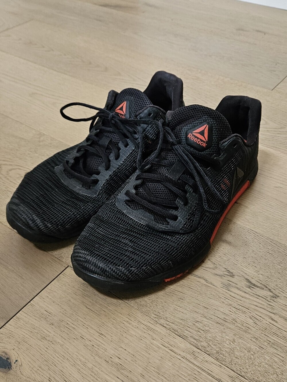 Reebok Men's Black Athletic Shoes with Red Accents
